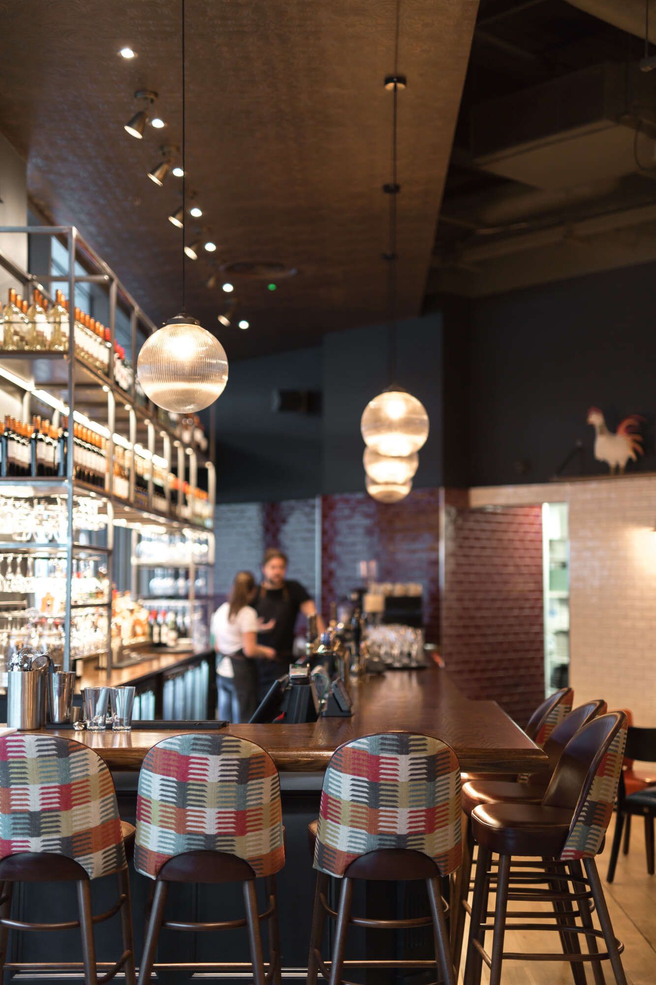 upstairs bar with stools all around