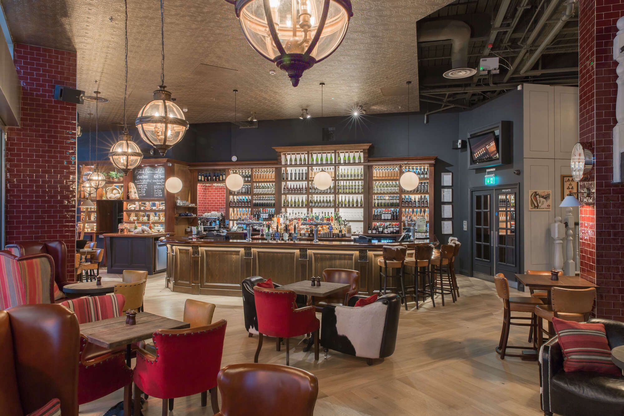 Main bar area at the bull with the wood panelled bar at the back