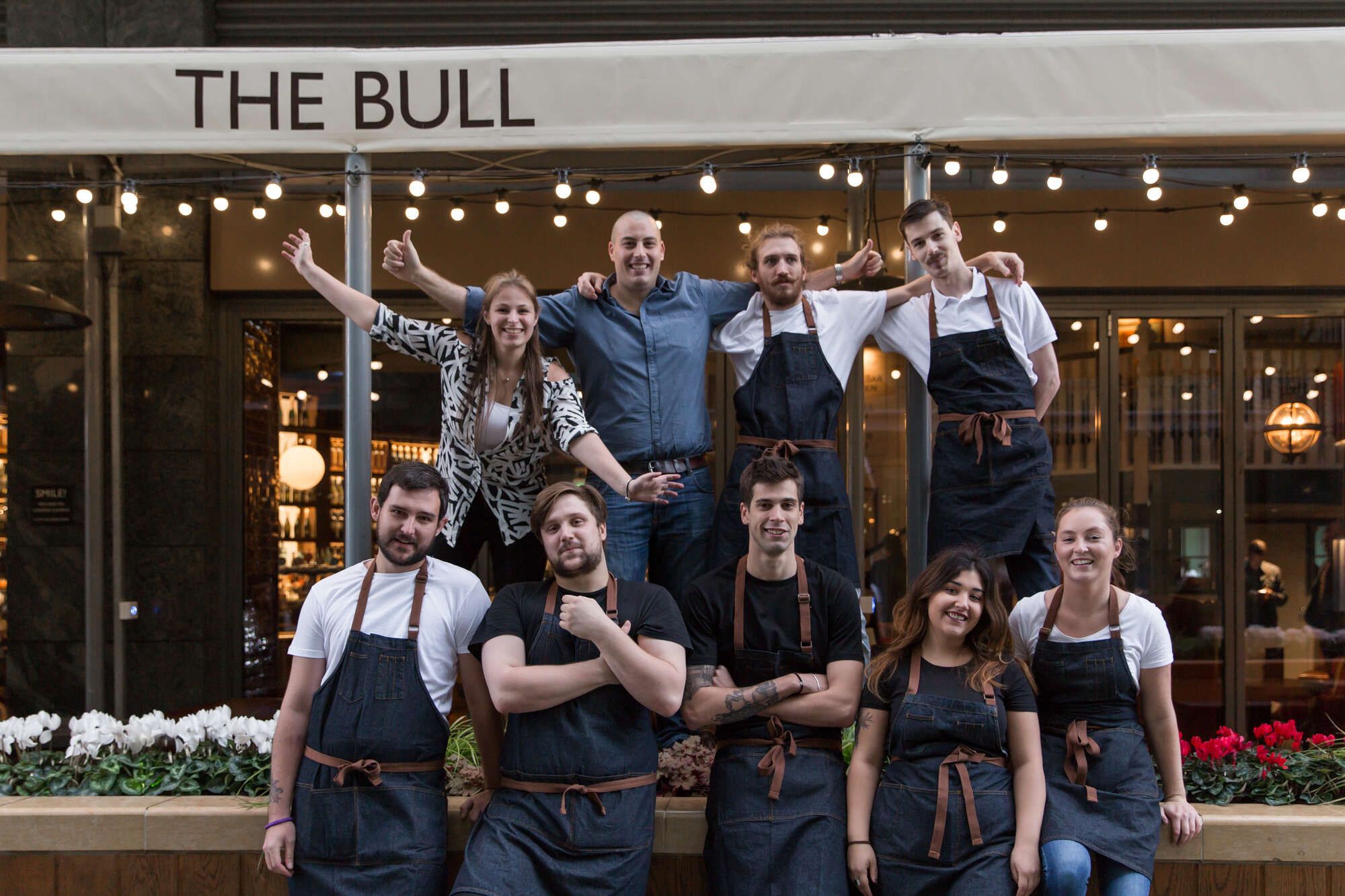 The team of the bull stood outside the pub