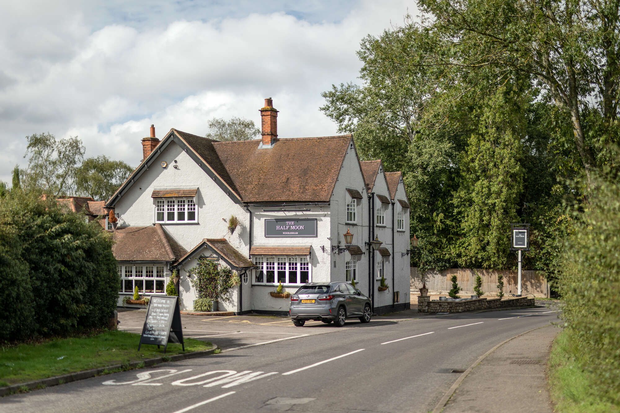 Exterior of the Half Moon Windlesham as seen from the road