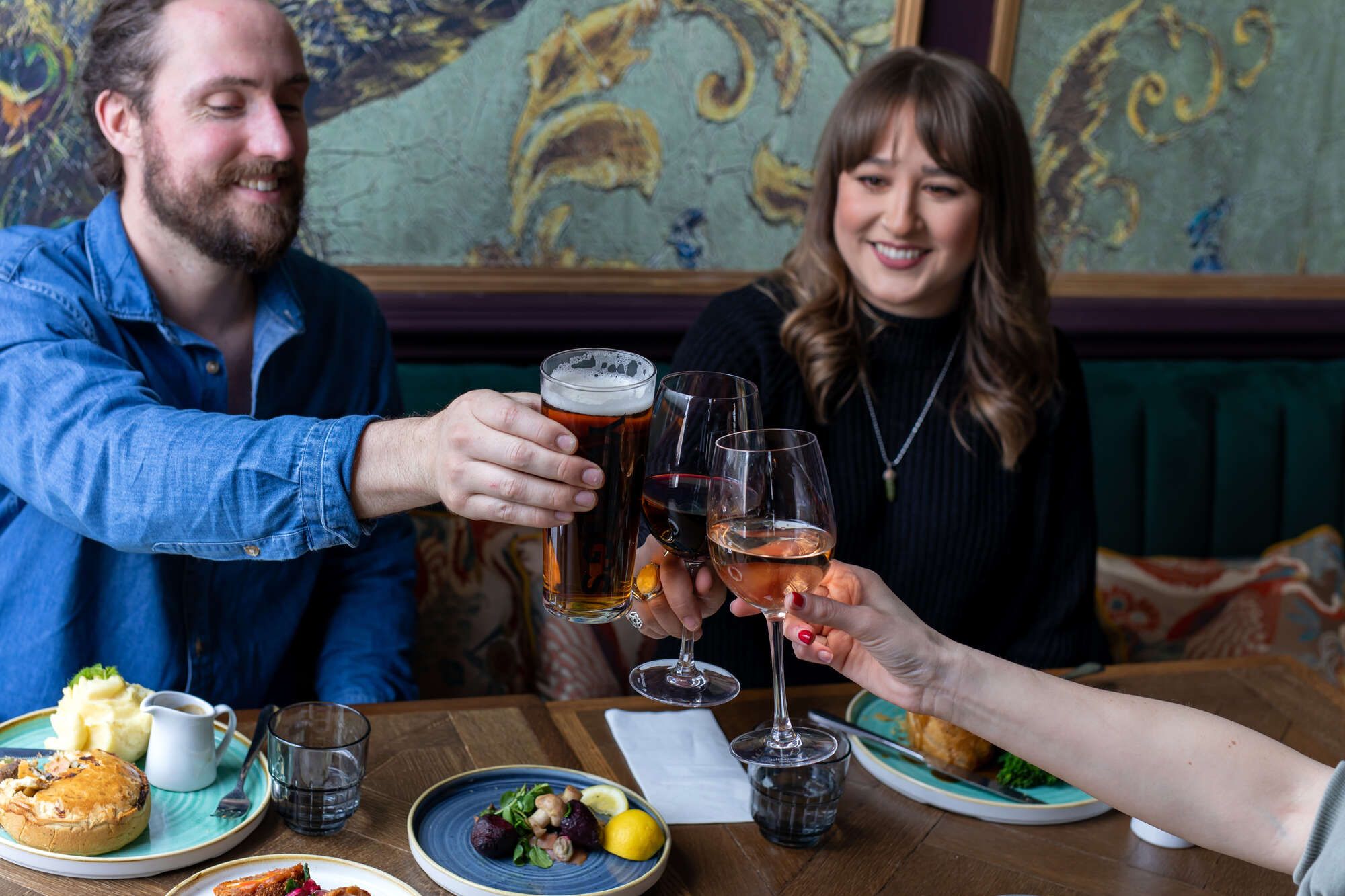 People celebrating with beer and food