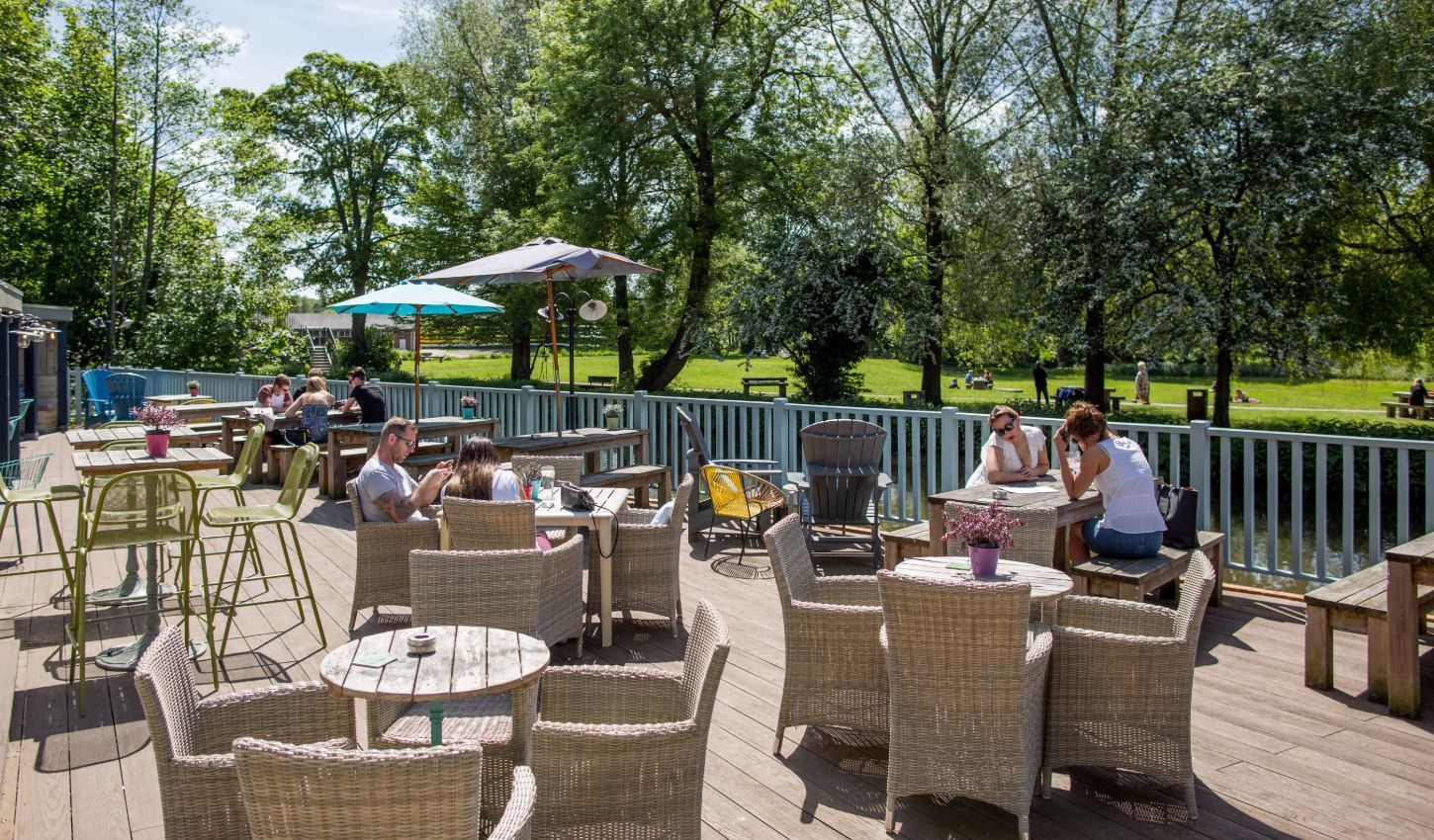 Young's outdoor pub area with view of park and river