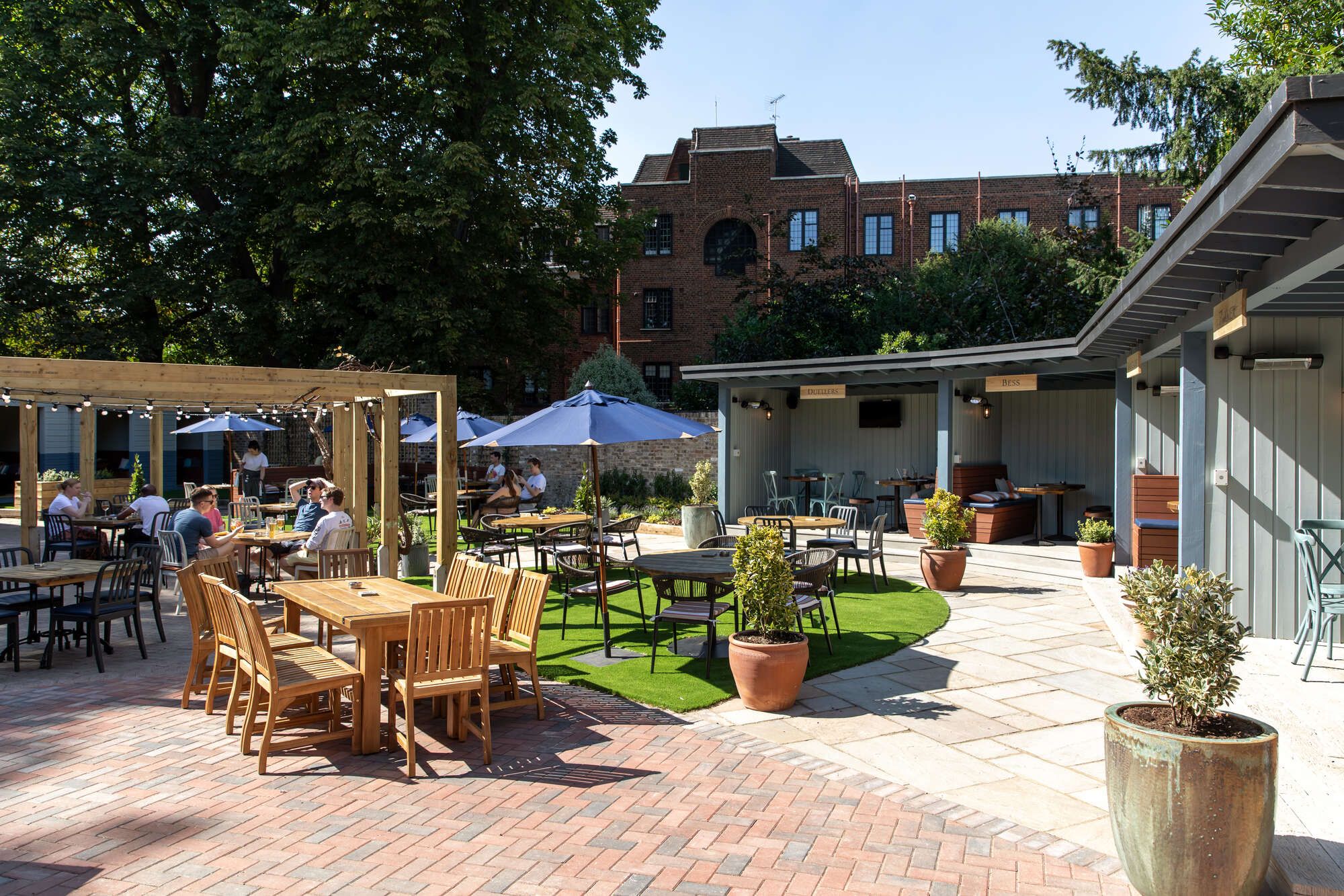 Open beer garden with garden huts and an outside bar