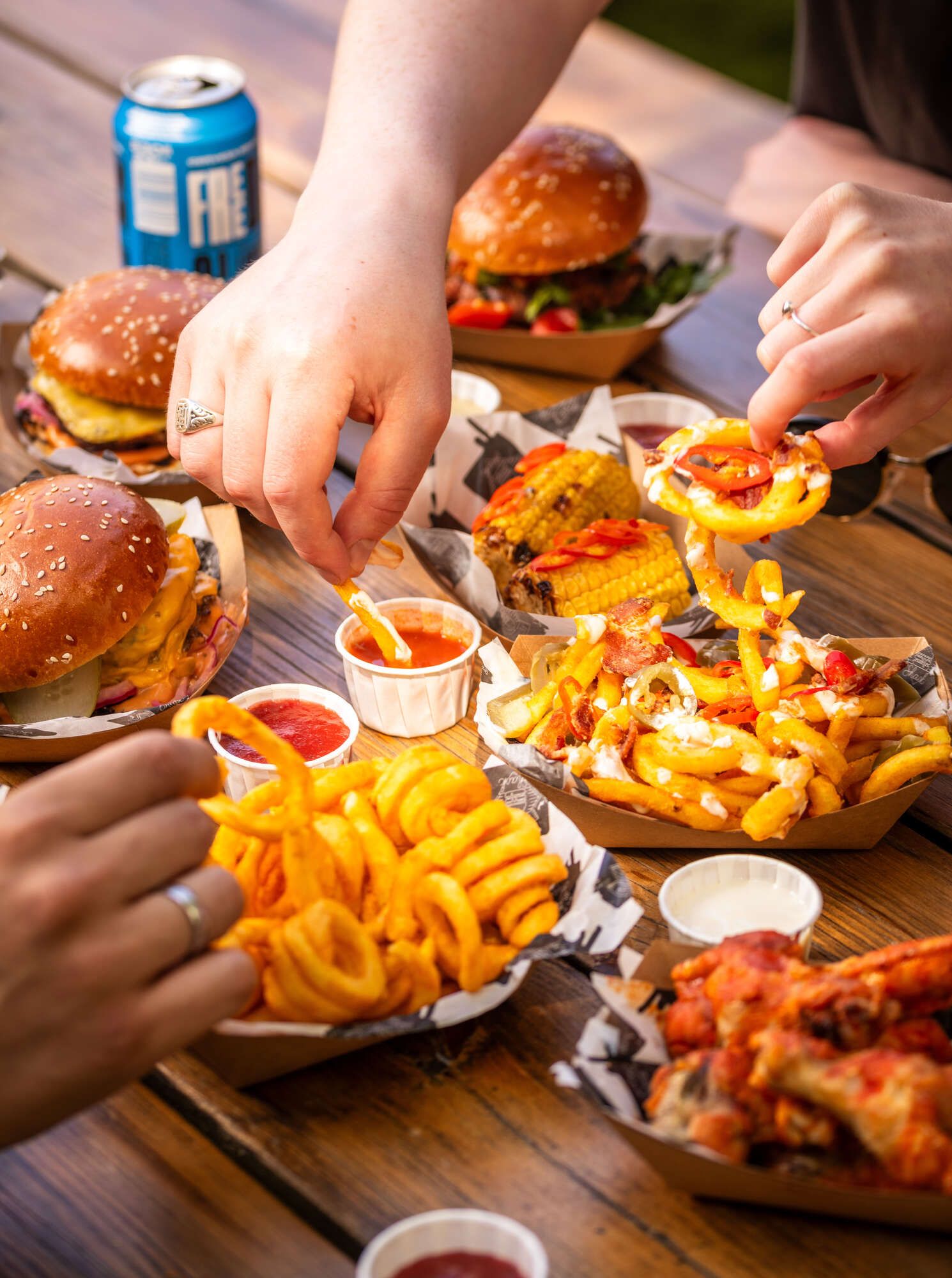 Table full of Burger Shack burgers and fries. Young's Pubs.