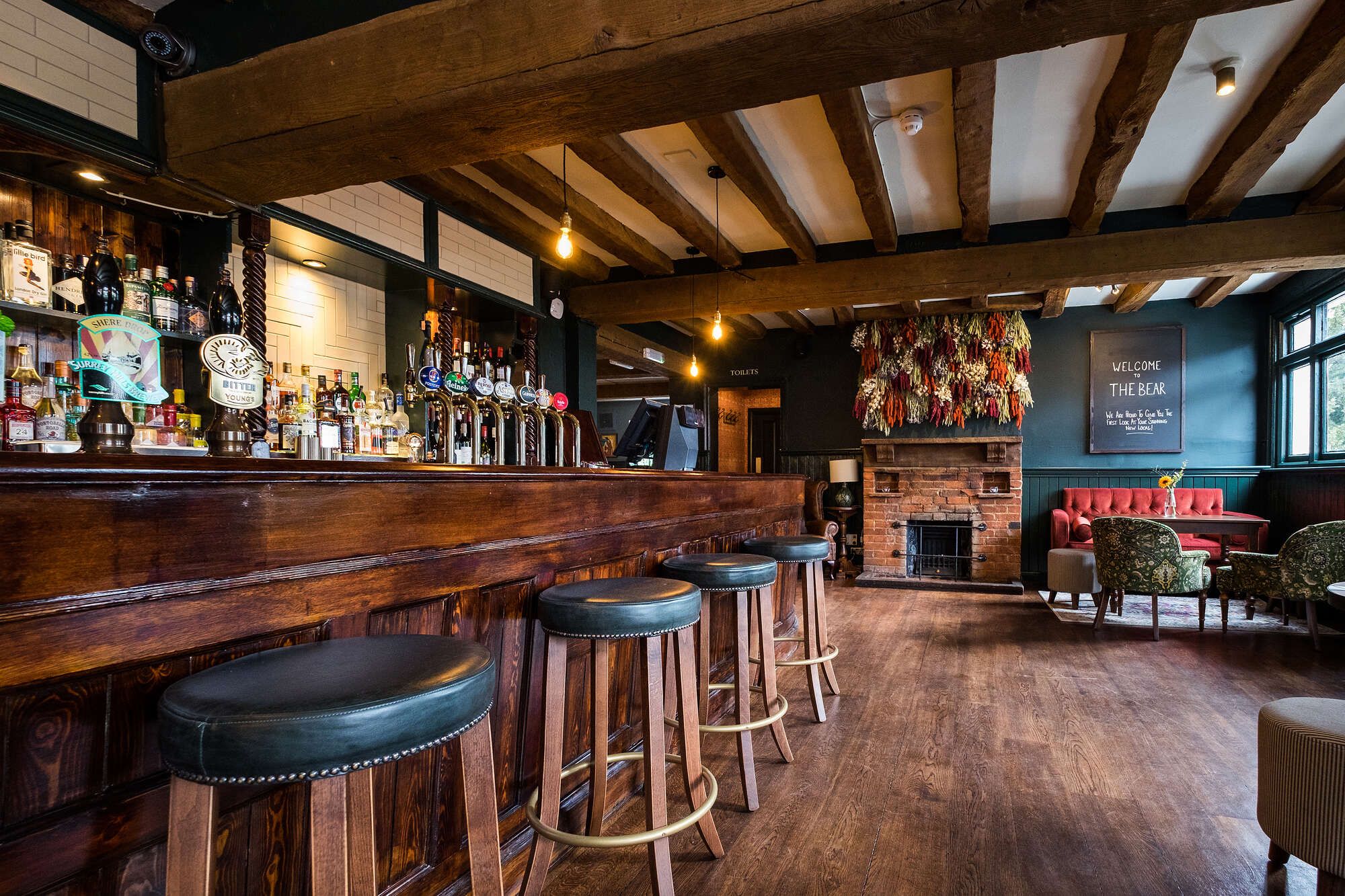 Cosy and historic bar area at The Bear, Cobham