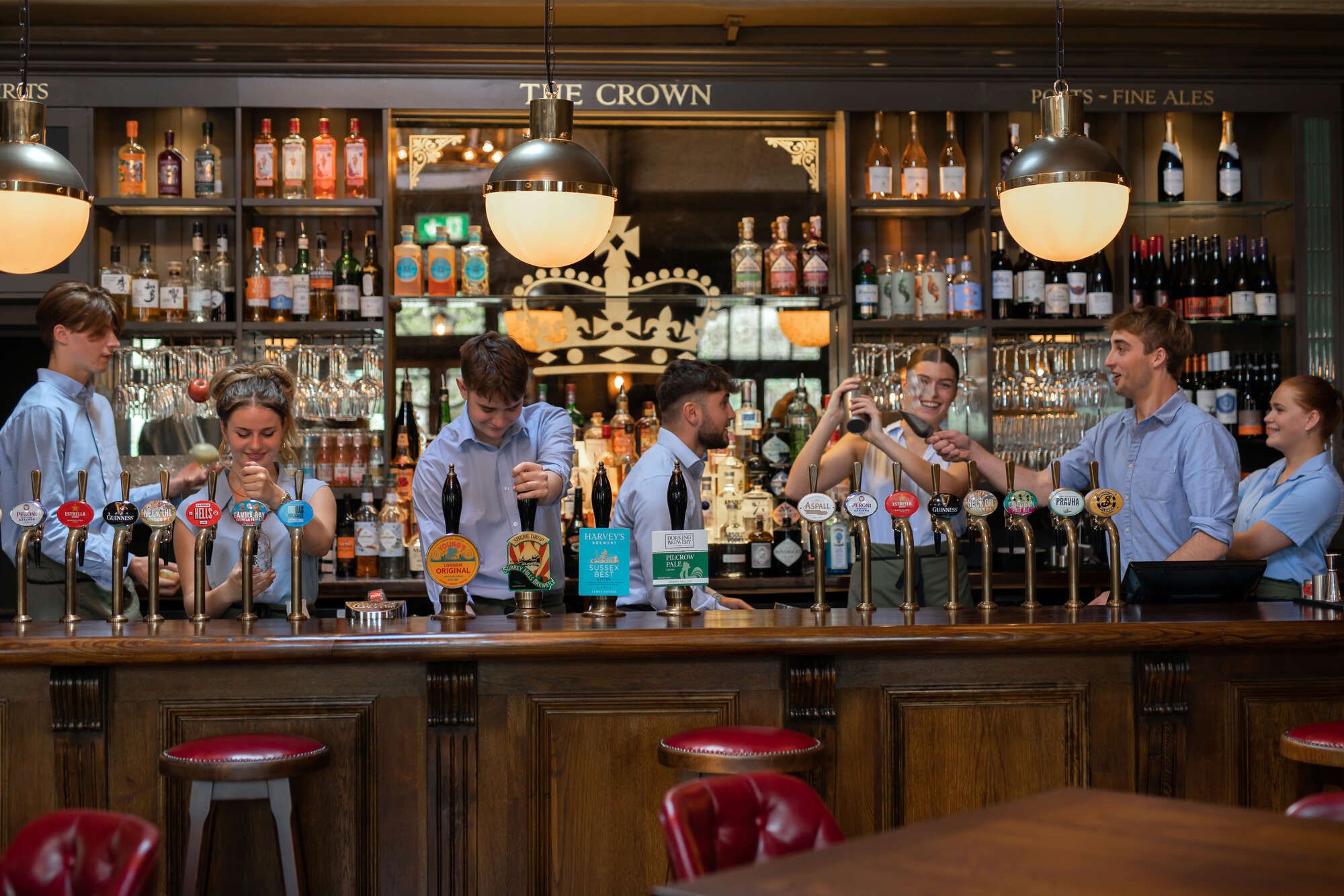 Team behind the bar at The Crown, St Margarets