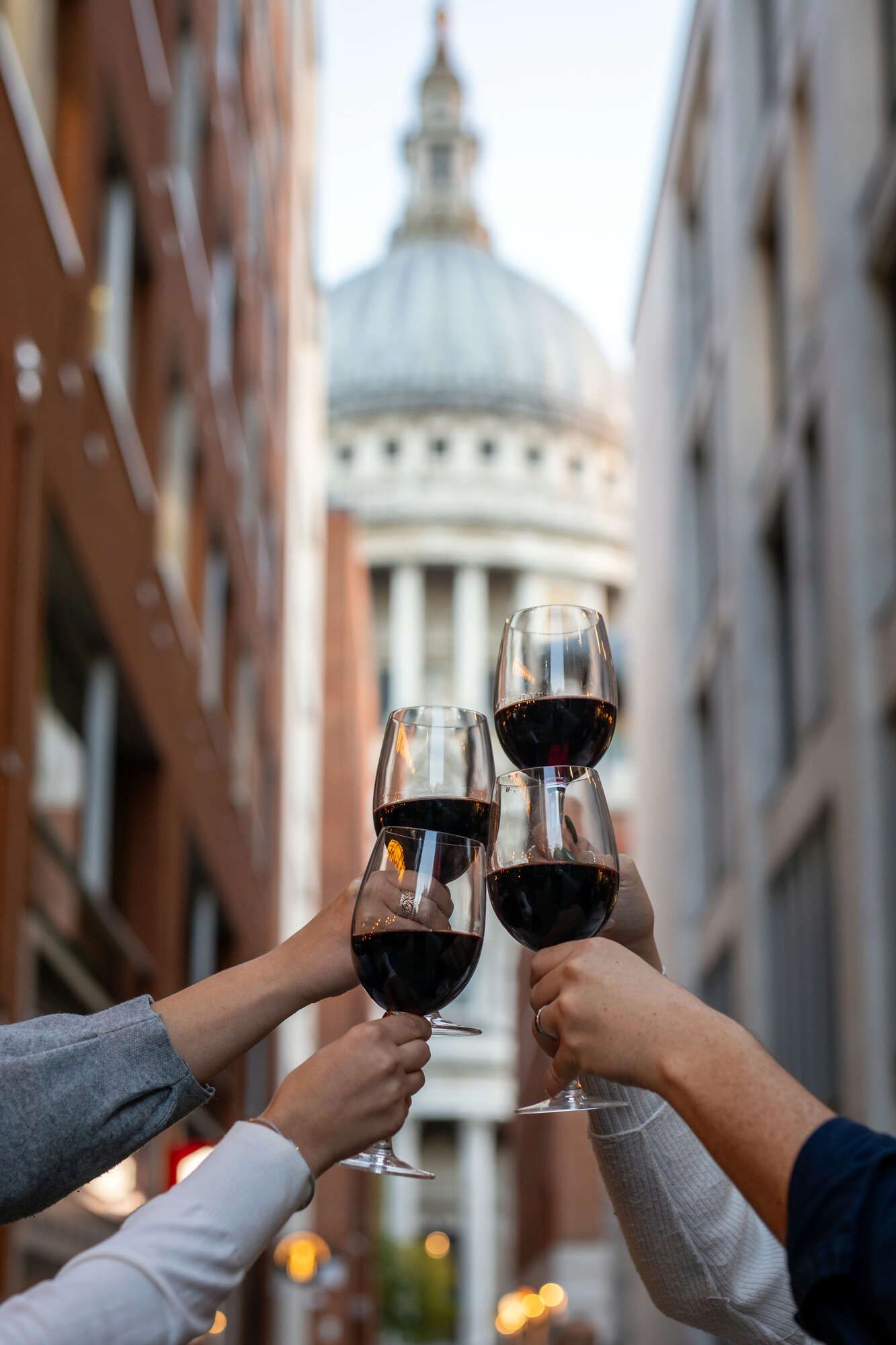 Raising a glass of wine in front of St Paul's Cathedral at the Paternoster pub